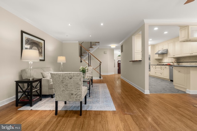 6358 Brampton Ct, Alexandria, VA 22304 - living area with light wood-style floors, stairway, baseboards, crown molding, and recessed lighting