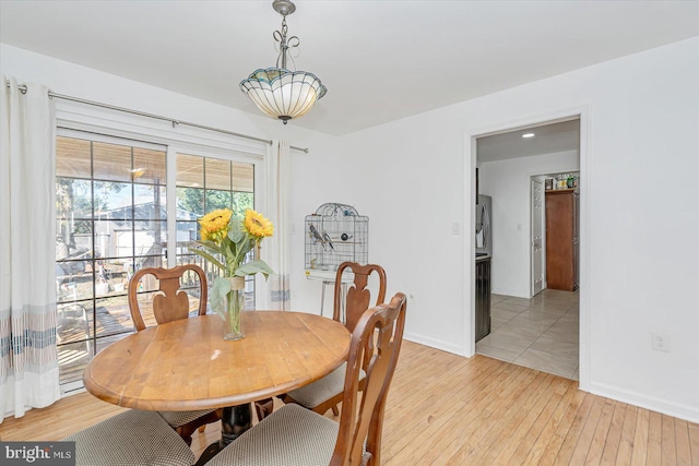6009 Shady Spring Ave, Rosedale, MD 21237 - dining area featuring light wood-style flooring and baseboards