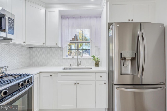 6009 Shady Spring Ave, Rosedale, MD 21237 - kitchen with appliances with stainless steel finishes, a sink, white cabinetry, light countertops, and backsplash