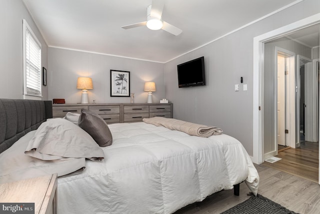 125 S Main St, Mahanoy City, PA 17948 - bedroom with crown molding, wood finished floors, and a ceiling fan