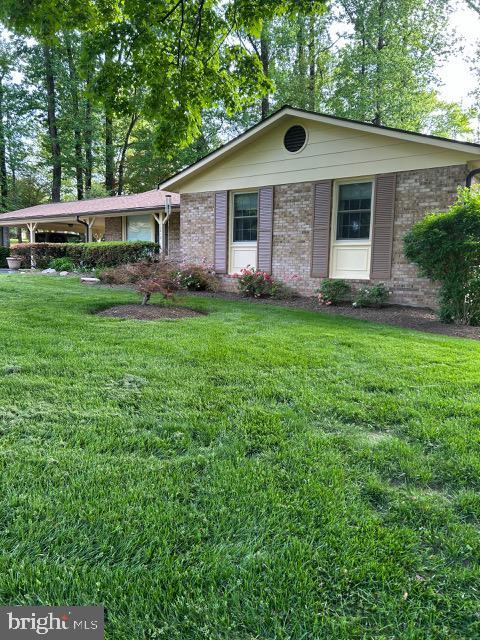 12810 Stonecrest Dr, Silver Spring, MD 20904 - ranch-style house with brick siding and a front lawn
