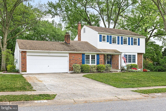 207 Wilshire Ln, Newark, DE 19711 - view of front of house with an attached garage, brick siding, and a front lawn