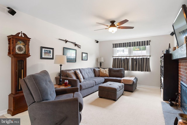 207 Wilshire Ln, Newark, DE 19711 - living area featuring a fireplace, light carpet, a ceiling fan, and baseboards