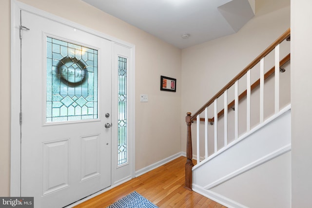207 Wilshire Ln, Newark, DE 19711 - entryway featuring wood finished floors, stairs, and baseboards