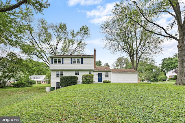 207 Wilshire Ln, Newark, DE 19711 - colonial home with a chimney and a front yard