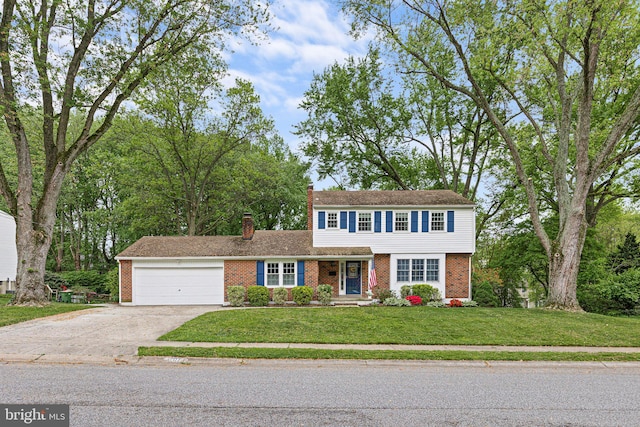 207 Wilshire Ln, Newark, DE 19711 - colonial home with brick siding, an attached garage, concrete driveway, a chimney, and a front yard