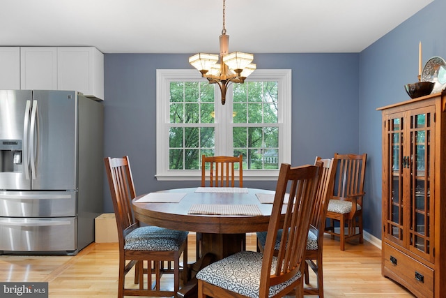 207 Wilshire Ln, Newark, DE 19711 - dining space featuring light wood-type flooring and a chandelier