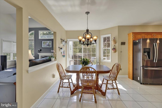 29 Colorado Ave, Sinking Spring, PA 19608 - dining room featuring a chandelier, baseboards, light tile patterned flooring, and plenty of natural light