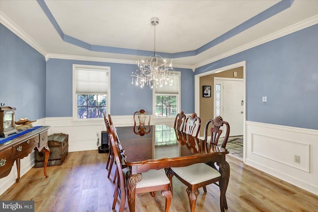 29 Colorado Ave, Sinking Spring, PA 19608 - dining room with a tray ceiling, a chandelier, wood finished floors, wainscoting, and ornamental molding