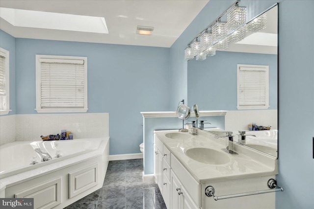 29 Colorado Ave, Sinking Spring, PA 19608 - full bath with double vanity, a bath, baseboards, and toilet