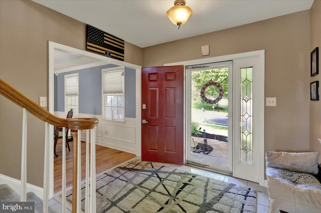 29 Colorado Ave, Sinking Spring, PA 19608 - foyer featuring stairs, a wainscoted wall, and light wood-type flooring