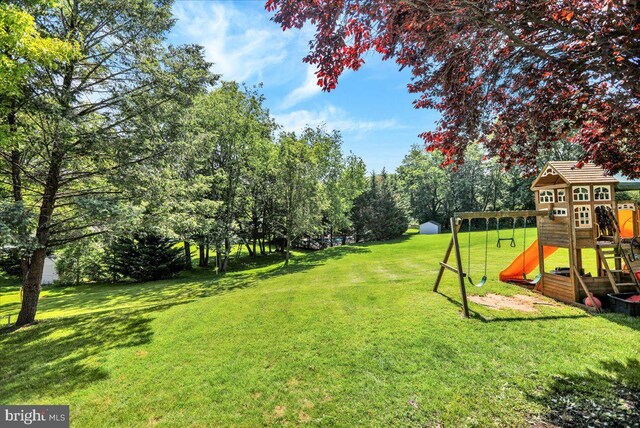 29 Colorado Ave, Sinking Spring, PA 19608 - view of grassy yard featuring a playground and view of wooded area