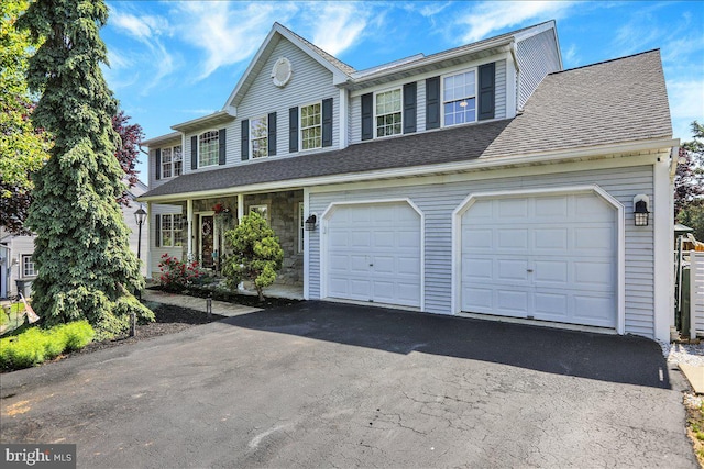 29 Colorado Ave, Sinking Spring, PA 19608 - view of front facade with asphalt driveway and roof with shingles