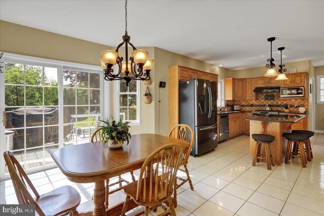 29 Colorado Ave, Sinking Spring, PA 19608 - dining space with light tile patterned floors and a chandelier