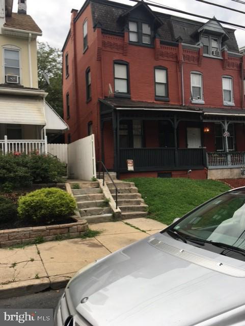 1023 N Front St, Reading, PA 19601 - view of front of home featuring covered porch and brick siding