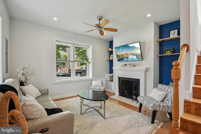 300 15th St SE, Washington, DC 20003 - living area featuring a ceiling fan, a fireplace, wood finished floors, stairs, and recessed lighting