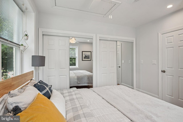 300 15th St SE, Washington, DC 20003 - bedroom with attic access, multiple windows, recessed lighting, and multiple closets