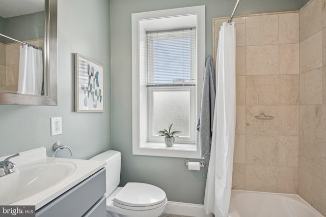 300 15th St SE, Washington, DC 20003 - bathroom featuring vanity, toilet, shower / bathtub combination with curtain, and baseboards
