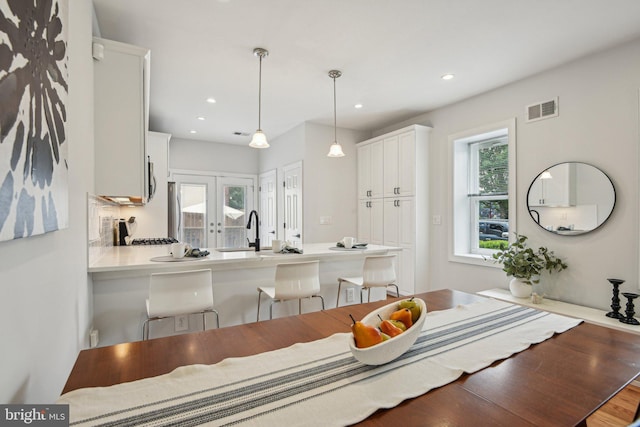 300 15th St SE, Washington, DC 20003 - dining space featuring french doors, recessed lighting, and wood finished floors