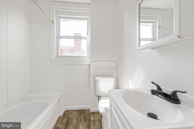 2204 Yelland St, Philadelphia, PA 19140 - full bath with toilet, wood finished floors, vanity, baseboards, and shower / tub combination