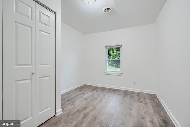 227 Elizabeth Ave, Baltimore, MD 21225 - empty room featuring wood finished floors and baseboards