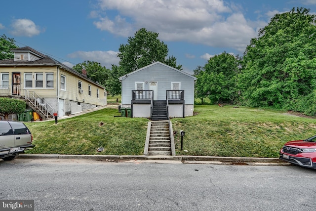 227 Elizabeth Ave, Baltimore, MD 21225 - view of front of property featuring stairs and a front yard