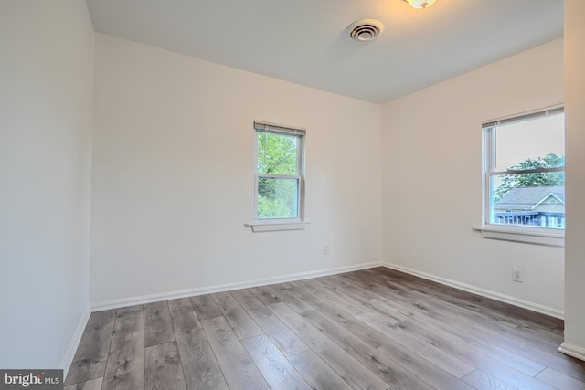227 Elizabeth Ave, Baltimore, MD 21225 - unfurnished room with wood finished floors and baseboards