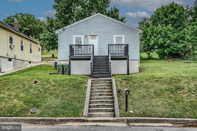 227 Elizabeth Ave, Baltimore, MD 21225 - view of front of home featuring stairway, a front lawn, and a deck