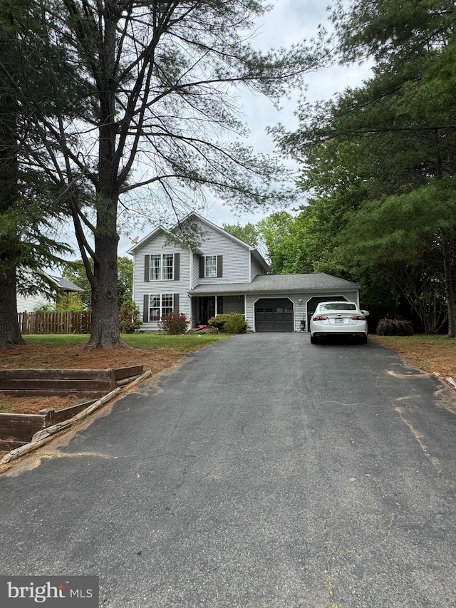 62 Vista Woods Rd, Stafford, VA 22556 - traditional home featuring an attached garage and asphalt driveway