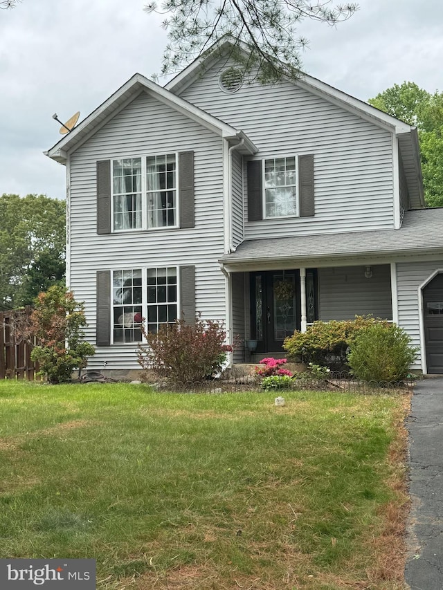62 Vista Woods Rd, Stafford, VA 22556 - traditional-style home with a front yard, an attached garage, and asphalt driveway