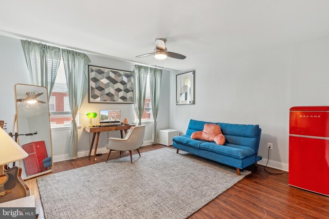 202 E Lafayette Ave, Baltimore, MD 21202 - living area with ceiling fan, wood finished floors, and baseboards