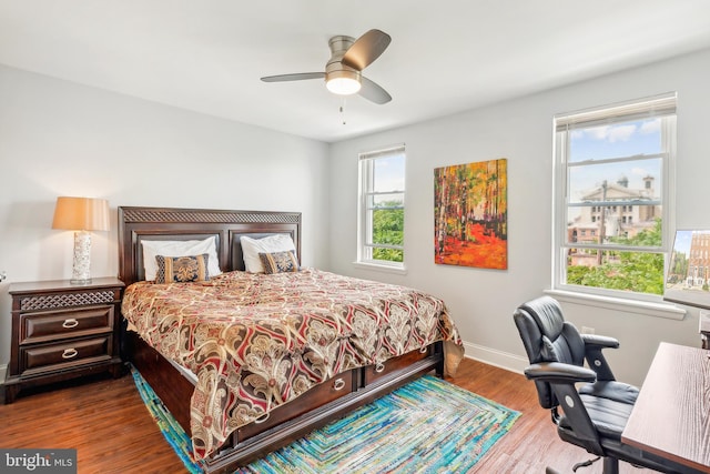 202 E Lafayette Ave, Baltimore, MD 21202 - bedroom featuring wood finished floors, baseboards, and a ceiling fan