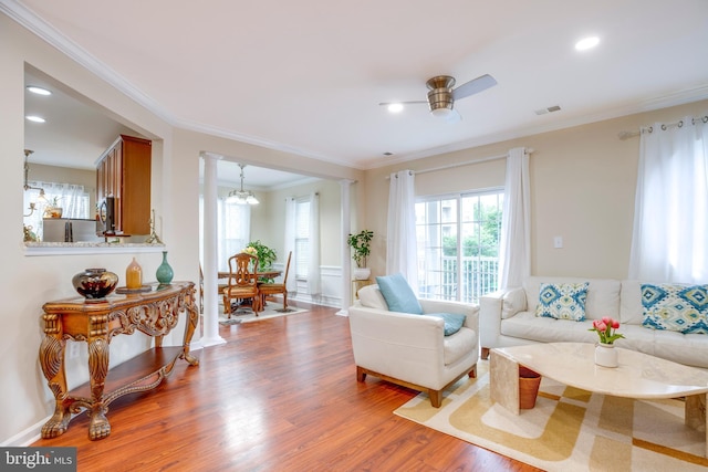 9722 Holmes Pl Unit 307, Manassas Park, VA 20111 - living area with wood finished floors, ceiling fan, crown molding, ornate columns, and recessed lighting
