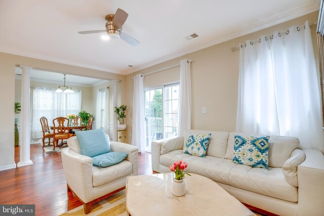9722 Holmes Pl Unit 307, Manassas Park, VA 20111 - living room featuring crown molding, wood finished floors, decorative columns, and ceiling fan