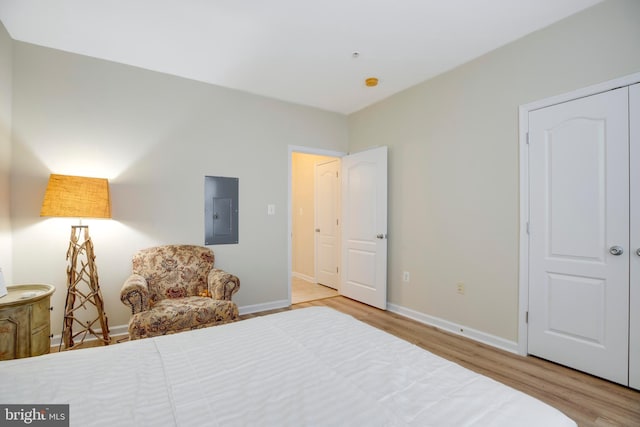9722 Holmes Pl Unit 307, Manassas Park, VA 20111 - bedroom featuring electric panel, wood finished floors, and baseboards