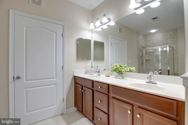 9722 Holmes Pl Unit 307, Manassas Park, VA 20111 - full bath featuring double vanity, a stall shower, and tile patterned flooring