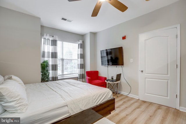9722 Holmes Pl Unit 307, Manassas Park, VA 20111 - bedroom with wood finished floors, baseboards, and ceiling fan