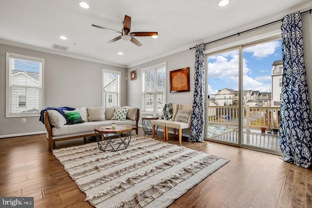 13304 Windy Meadow Ln, Silver Spring, MD 20906 - living room featuring crown molding, a ceiling fan, healthy amount of natural light, wood finished floors, and baseboards