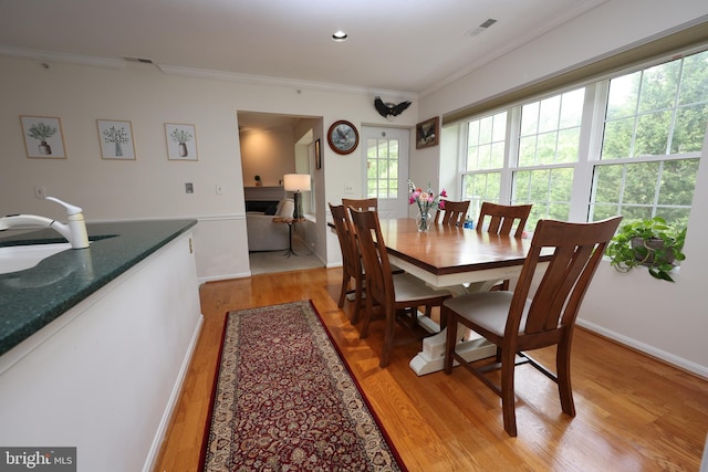 508 Limerick Cir Unit 402, Lutherville Timonium, MD 21093 - dining room with light wood-style flooring, crown molding, and baseboards