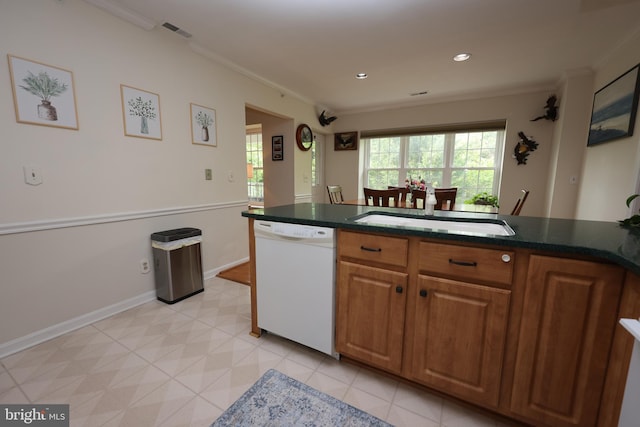 508 Limerick Cir Unit 402, Lutherville Timonium, MD 21093 - kitchen with dishwasher, a sink, crown molding, brown cabinetry, and baseboards