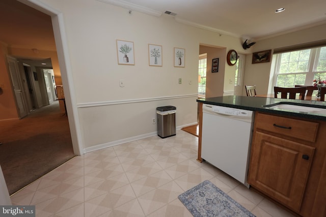 508 Limerick Cir Unit 402, Lutherville Timonium, MD 21093 - kitchen with white dishwasher, ornamental molding, dark countertops, baseboards, and brown cabinets