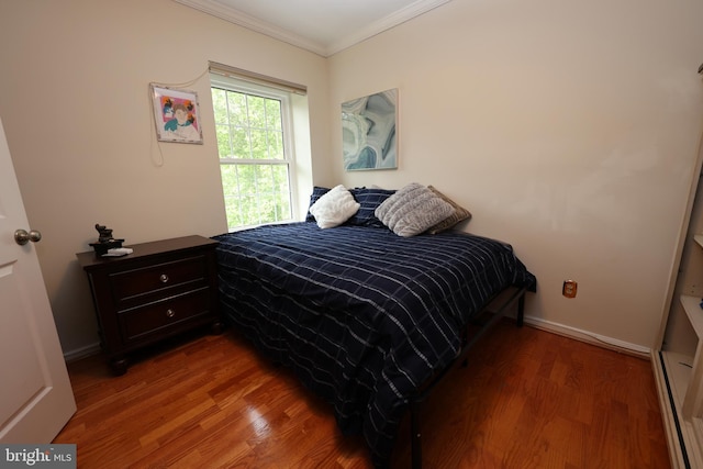 508 Limerick Cir Unit 402, Lutherville Timonium, MD 21093 - bedroom with ornamental molding, wood finished floors, baseboards, and a baseboard radiator
