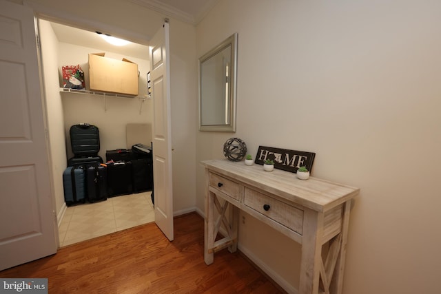 508 Limerick Cir Unit 402, Lutherville Timonium, MD 21093 - hallway featuring a desk, light wood-type flooring, and crown molding
