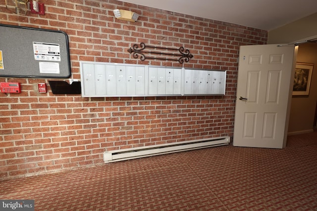 508 Limerick Cir Unit 402, Lutherville Timonium, MD 21093 - detailed view of mail area, a baseboard radiator, and brick wall