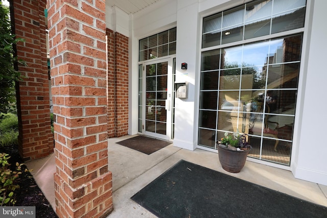 508 Limerick Cir Unit 402, Lutherville Timonium, MD 21093 - entrance to property featuring brick siding and a porch