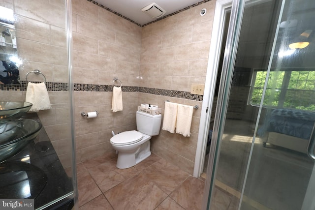 508 Limerick Cir Unit 402, Lutherville Timonium, MD 21093 - full bathroom with tile walls, a shower stall, vanity, toilet, and tile patterned flooring