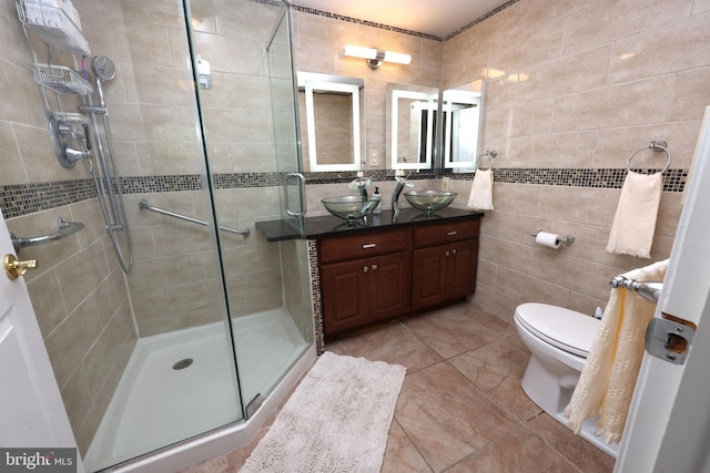 508 Limerick Cir Unit 402, Lutherville Timonium, MD 21093 - full bathroom with double vanity, a stall shower, tile walls, toilet, and tile patterned floors