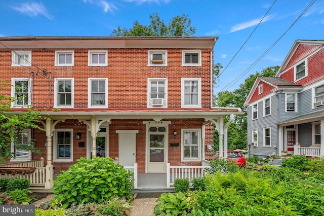 124 E Oakland Ave, Doylestown, PA 18901 - view of property featuring covered porch, brick siding, and cooling unit