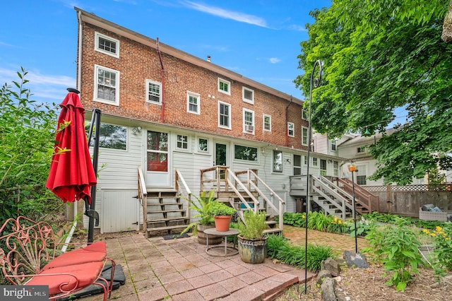 124 E Oakland Ave, Doylestown, PA 18901 - rear view of house featuring stairway, entry steps, and a patio area