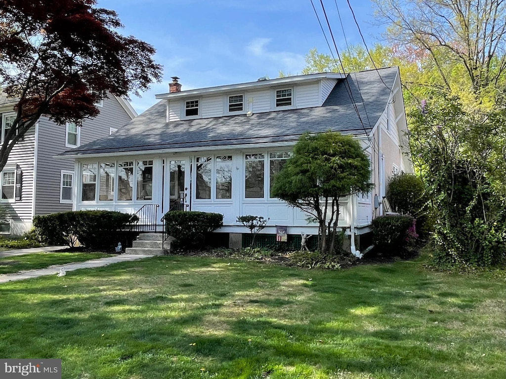 1924 Juniata, Norristown, PA 19403 - bungalow-style home with a front lawn, roof with shingles, and a chimney